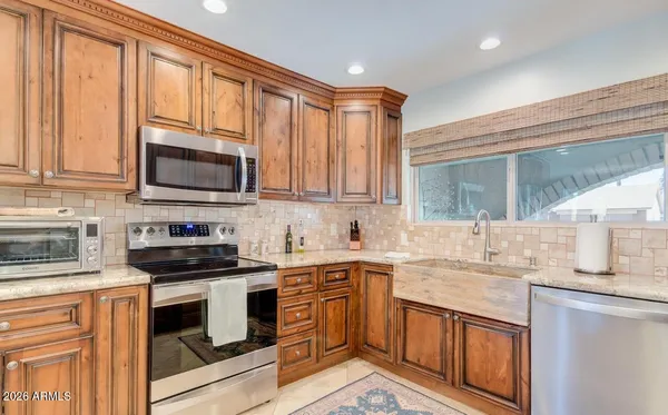a kitchen with a dining table and chairs