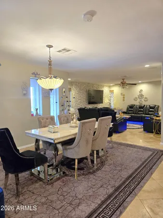 a bed room with furniture and a chandelier