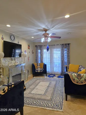 a bedroom with furniture and a flat screen tv