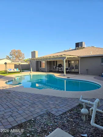 a view of swimming pool with a yard