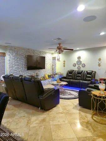 a living room with furniture and a rug