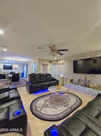 a living room with furniture and flat screen tv