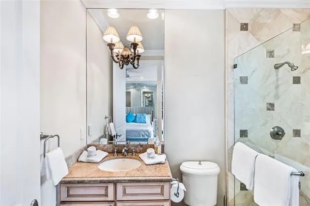 a spacious bedroom with a bed and a couch