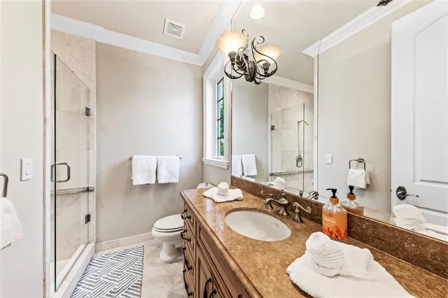 a bathroom with a shower and toilet