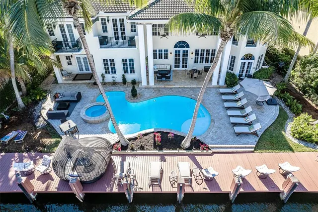 a view of a lake with a table and chairs