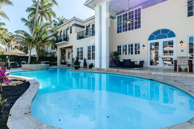 a view of a house with a swimming pool