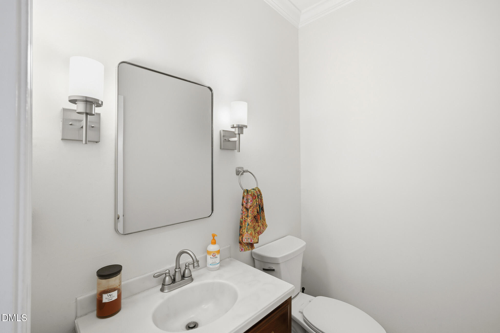 3735 Stoneybrook Drive Durham, NC 27705 - Photo 19 of 44 a bathroom with a toilet sink and mirror