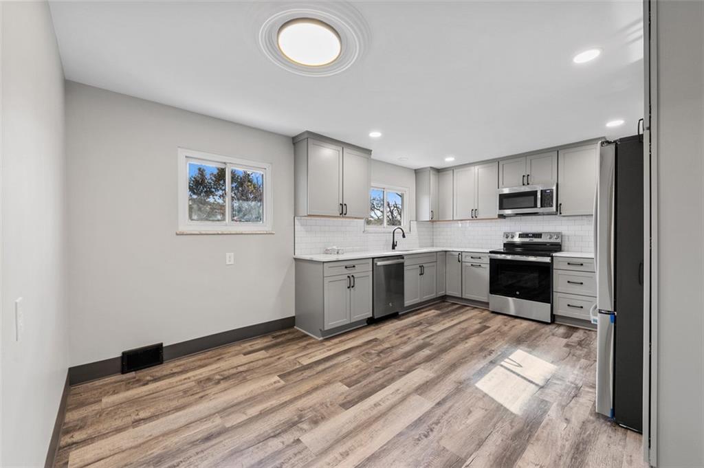 3767 Wiestertown Road Export, PA 15632 - Photo 12 of 34 a kitchen with a refrigerator sink and cabinets