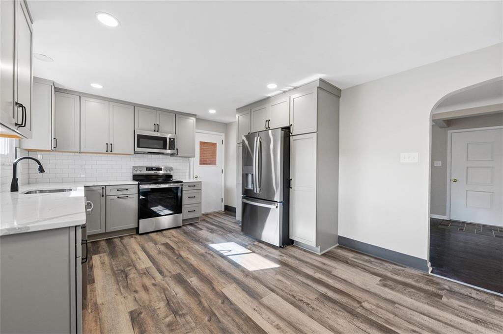 3767 Wiestertown Road Export, PA 15632 - Photo 13 of 34 a kitchen with a refrigerator a sink and a stove