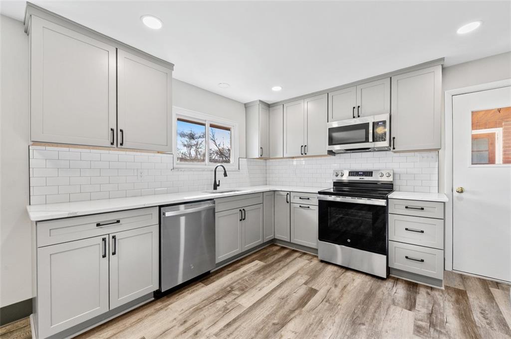 3767 Wiestertown Road Export, PA 15632 - Photo 14 of 34 a kitchen with cabinets appliances and a sink