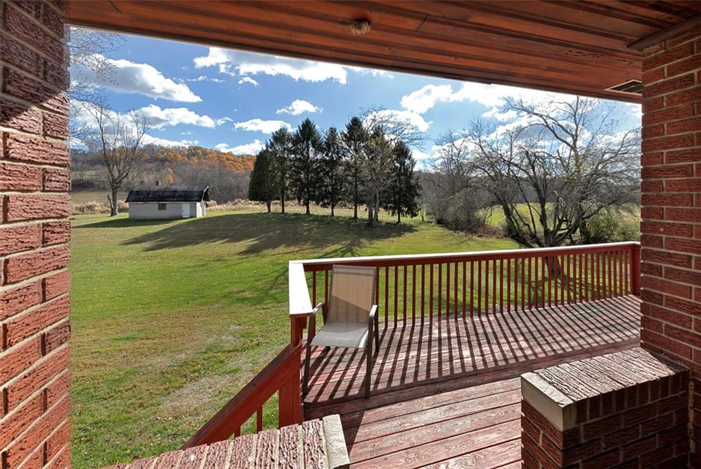 3767 Wiestertown Road Export, PA 15632 - Photo 5 of 34 a view of a balcony with floor to ceiling windows yard and outdoor seating