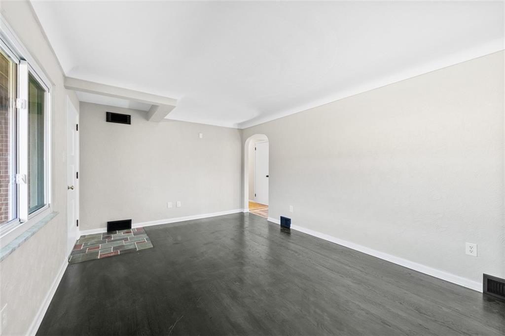 3767 Wiestertown Road Export, PA 15632 - Photo 10 of 34 an empty room with wooden floor and windows