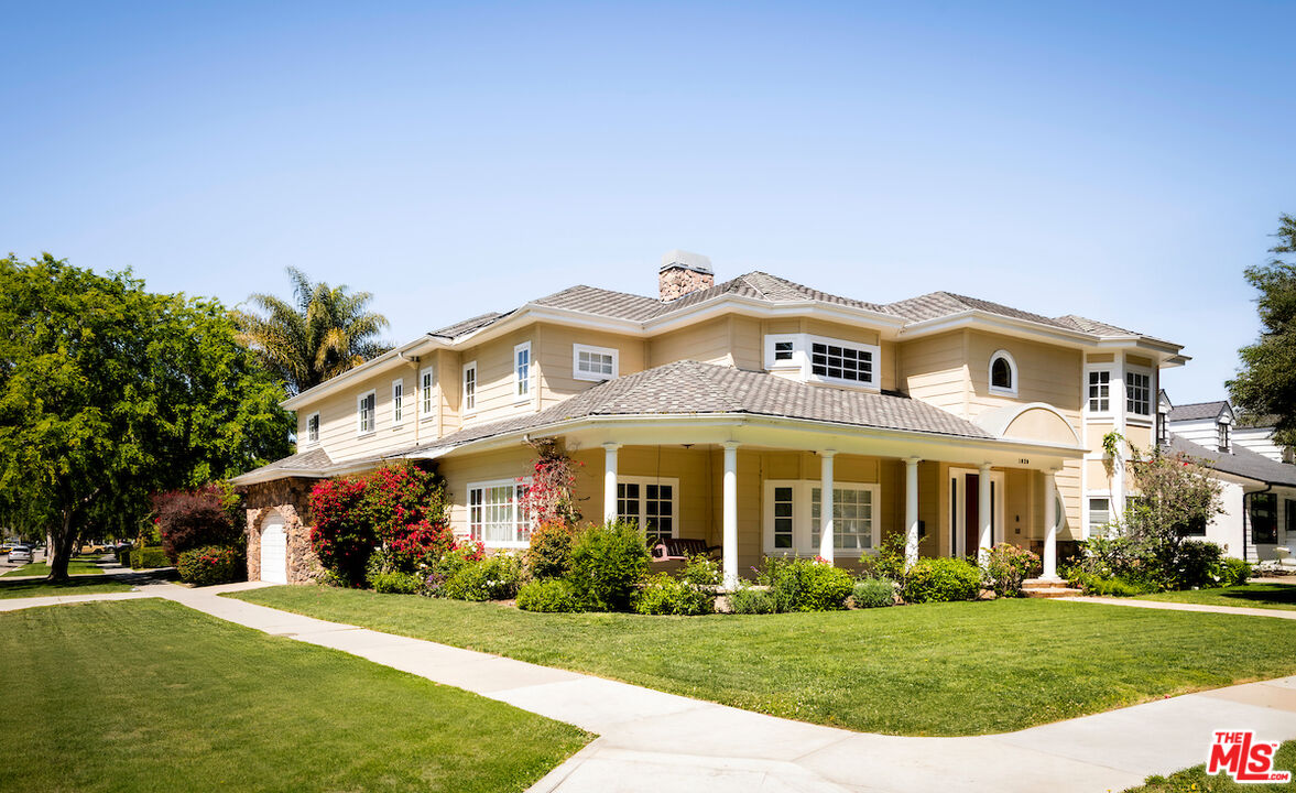 front view of a building with a yard