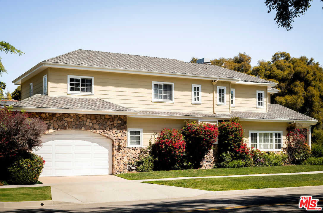 1629 Reeves Street Los Angeles, CA 90035 - Photo 4 of 7 a front view of a house with a yard