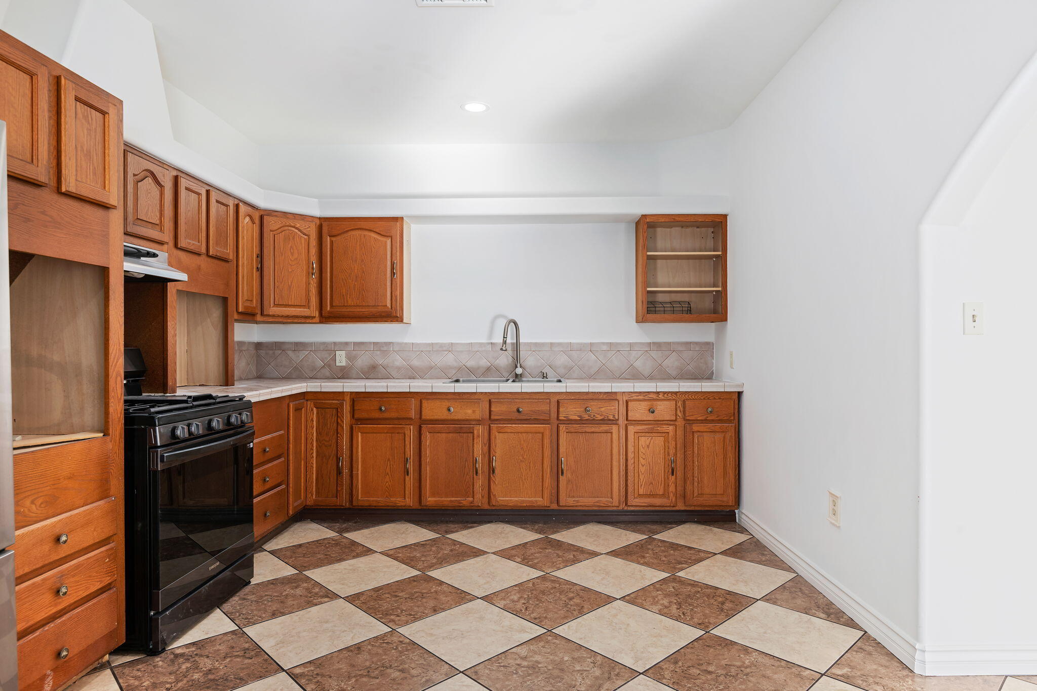 717 West Villanova Road Ojai, CA 93023 - Photo 11 of 34 a kitchen with stainless steel appliances granite countertop a sink stove and refrigerator