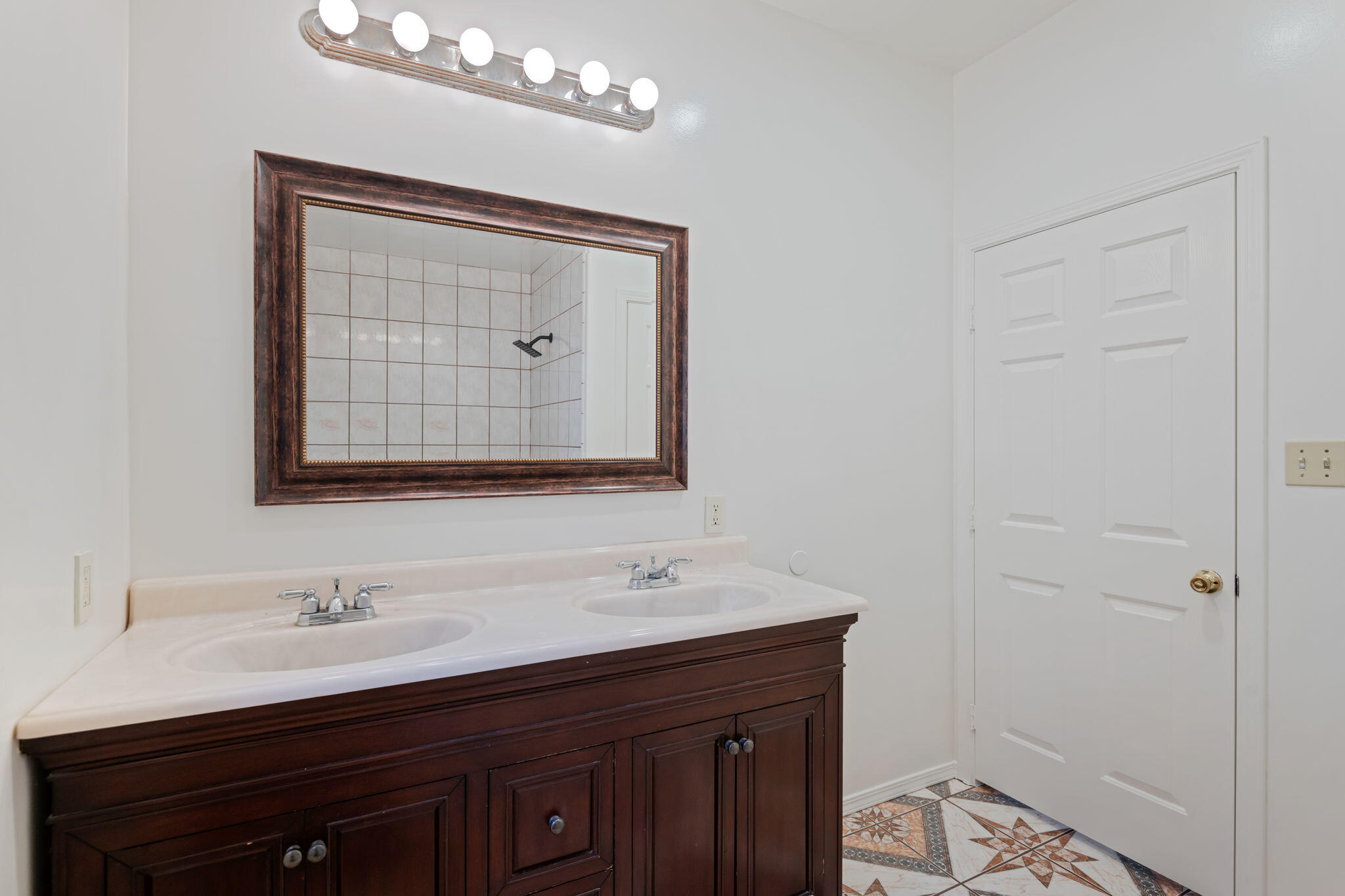 717 West Villanova Road Ojai, CA 93023 - Photo 18 of 34 a bathroom with a double vanity sink and a mirror
