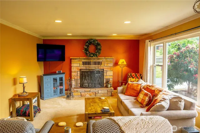 a living room with furniture a lamp and a large window