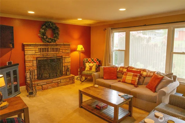 a living room with furniture and a fireplace