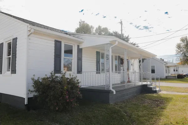 a view of a patio with table and chairs a barbeque with wooden fence