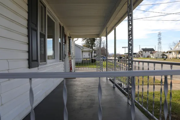 a view of a balcony with chairs