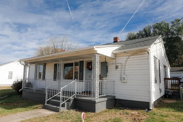 a view of a white house with a door