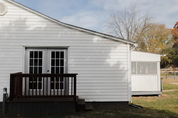 a view of backyard with cabin