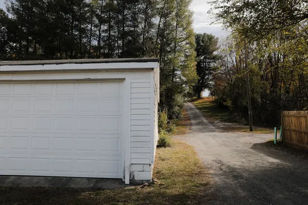 a view of a kitchen with window and wooden floor