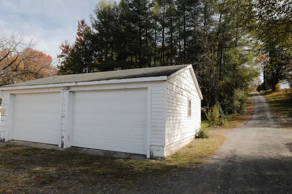 a kitchen with stainless steel appliances granite countertop a stove a refrigerator and a sink