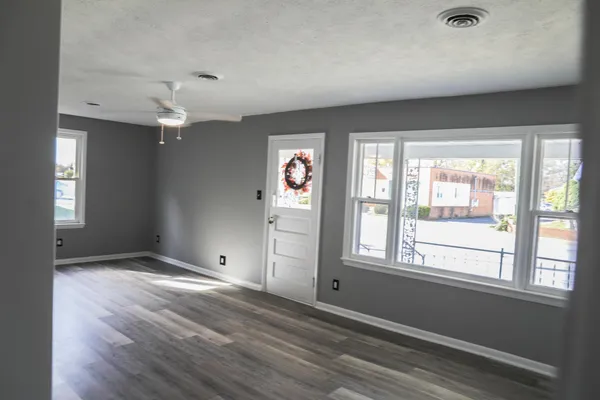 a view of an empty room with storage