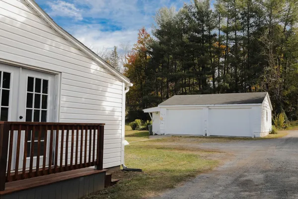 a view of a porch with a floor to ceiling window