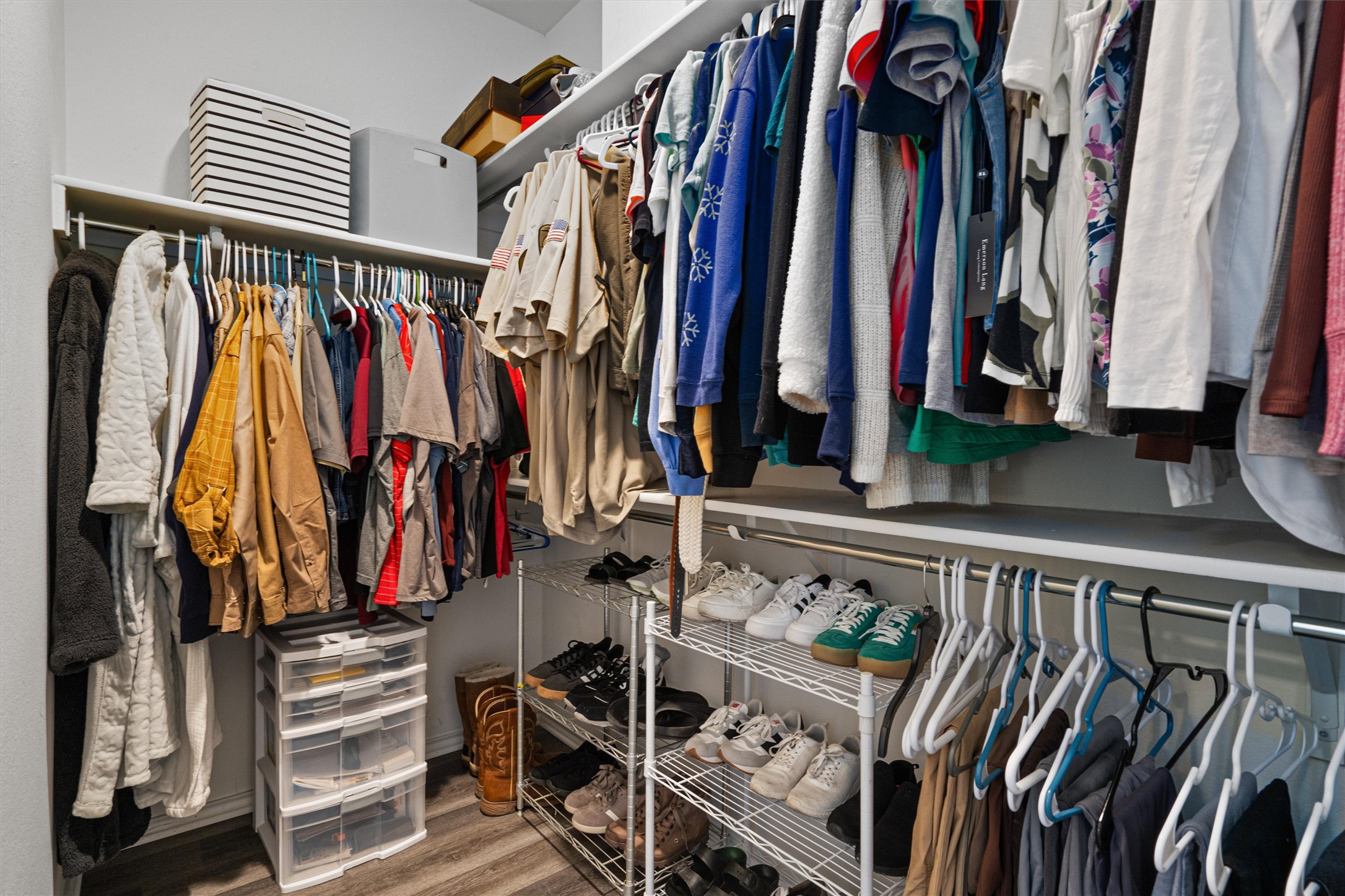 1906 Dragonfly Loop Bastrop, TX 78602 - Photo 19 of 34 a view of walk in closet with clothes and shoes
