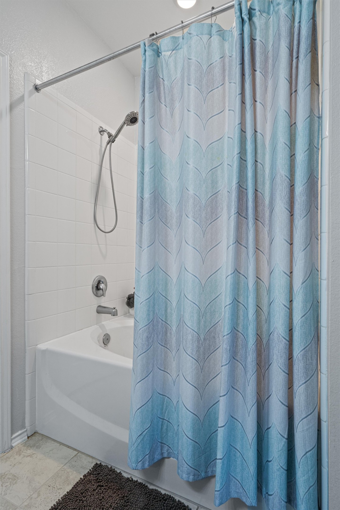 1906 Dragonfly Loop Bastrop, TX 78602 - Photo 21 of 34 a bathroom with a shower and a tub
