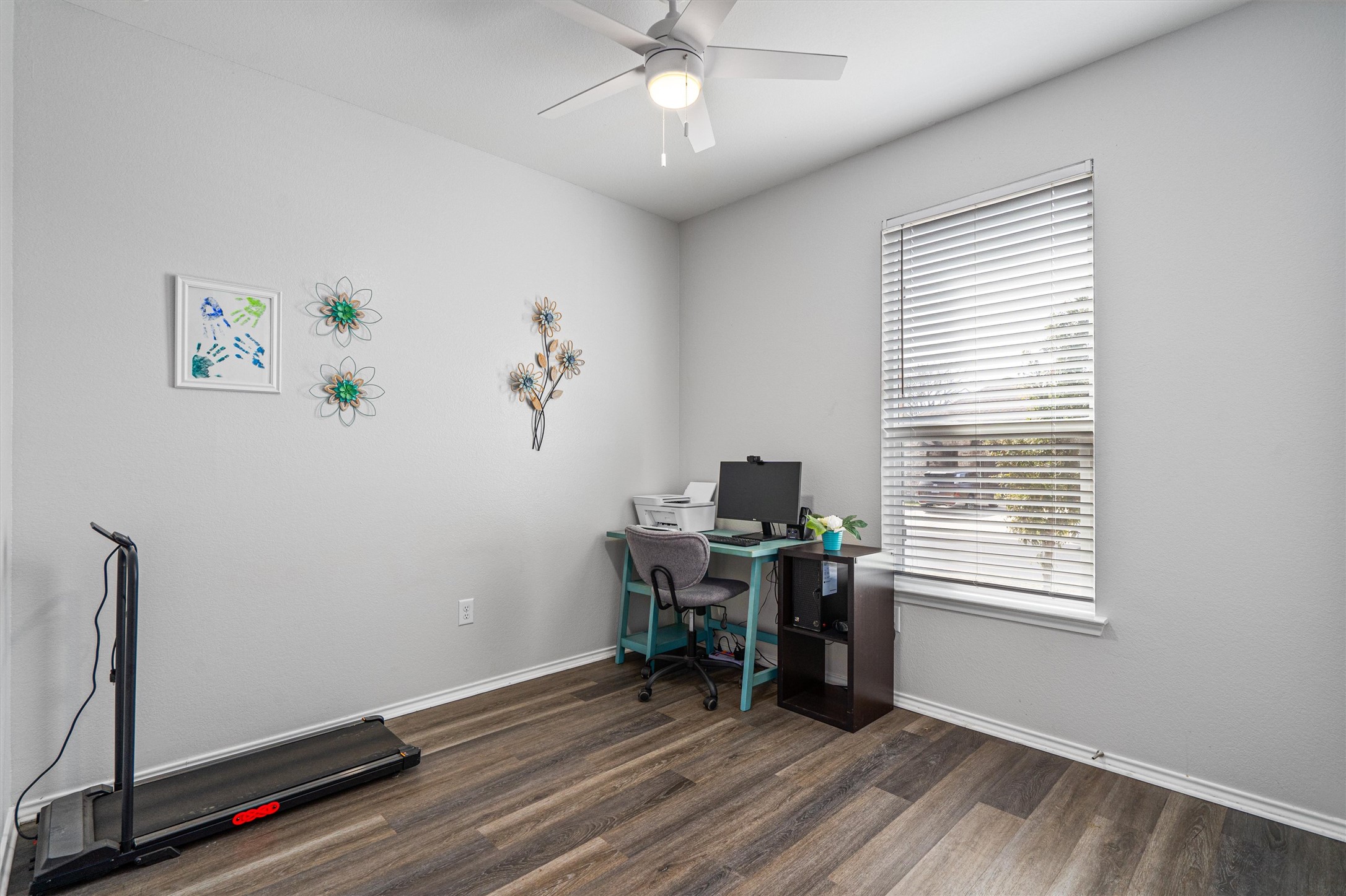 1906 Dragonfly Loop Bastrop, TX 78602 - Photo 22 of 34 a view of a workspace with furniture and a window