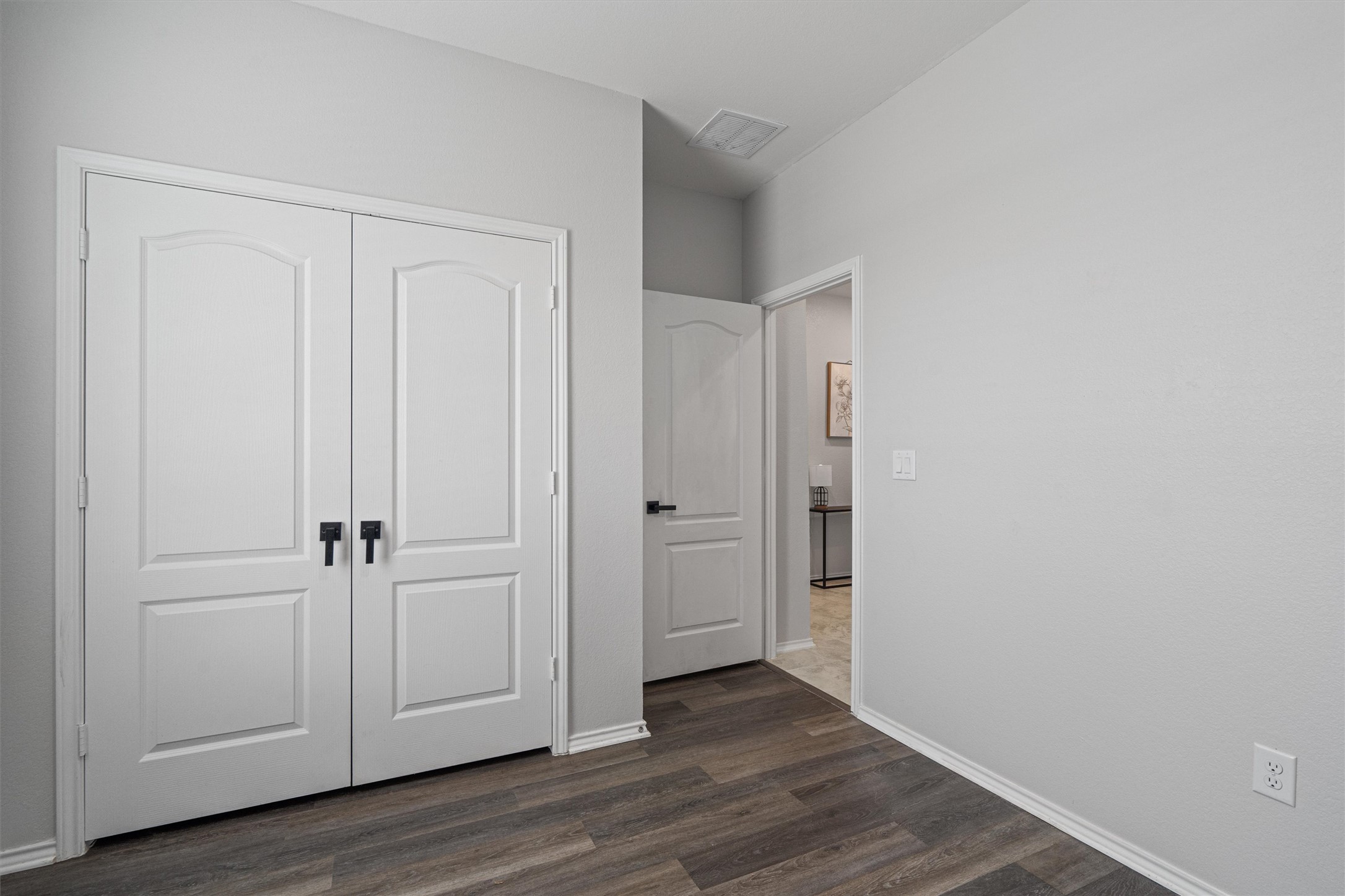 1906 Dragonfly Loop Bastrop, TX 78602 - Photo 23 of 34 an empty room with wooden floor