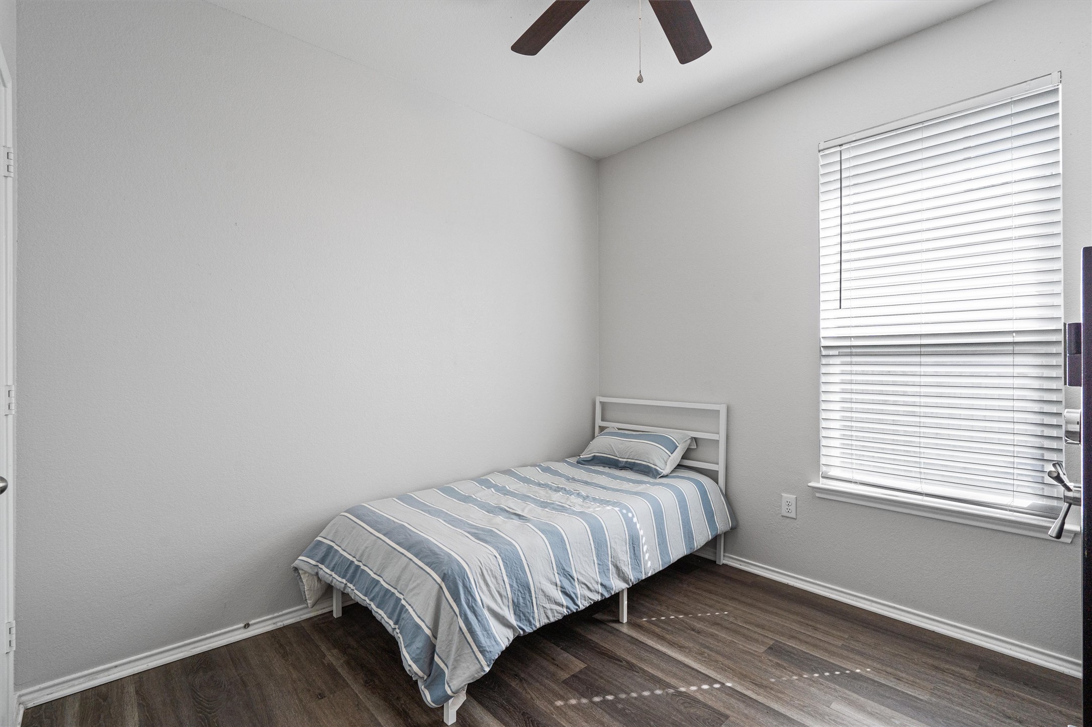 1906 Dragonfly Loop Bastrop, TX 78602 - Photo 24 of 34 a bedroom with a bed and a window
