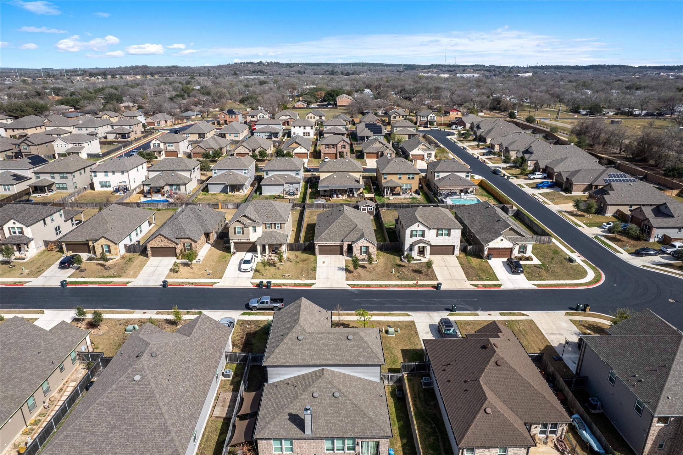 1906 Dragonfly Loop Bastrop, TX 78602 - Photo 3 of 34 an aerial view of residential houses with outdoor space