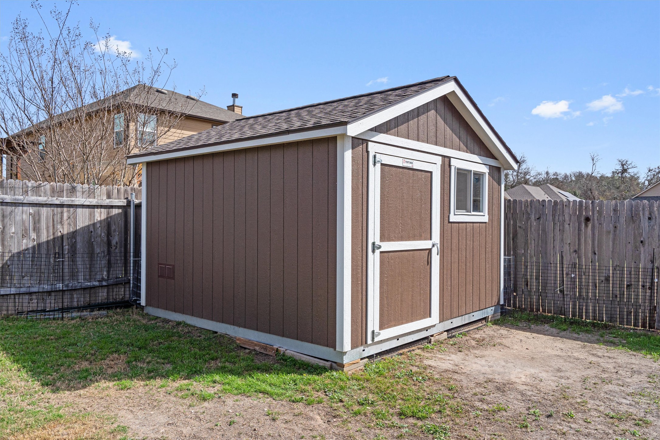 1906 Dragonfly Loop Bastrop, TX 78602 - Photo 32 of 34 a view of backyard of house with wooden fence