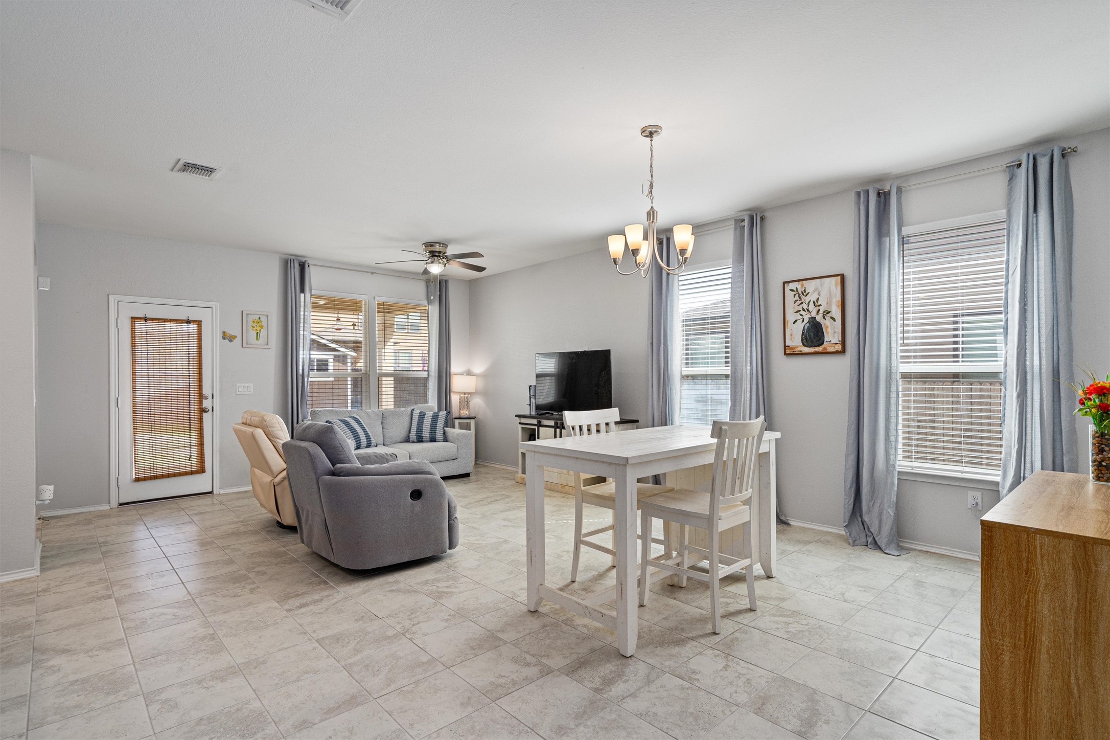 1906 Dragonfly Loop Bastrop, TX 78602 - Photo 7 of 34 a view of a livingroom with furniture and a flat screen tv