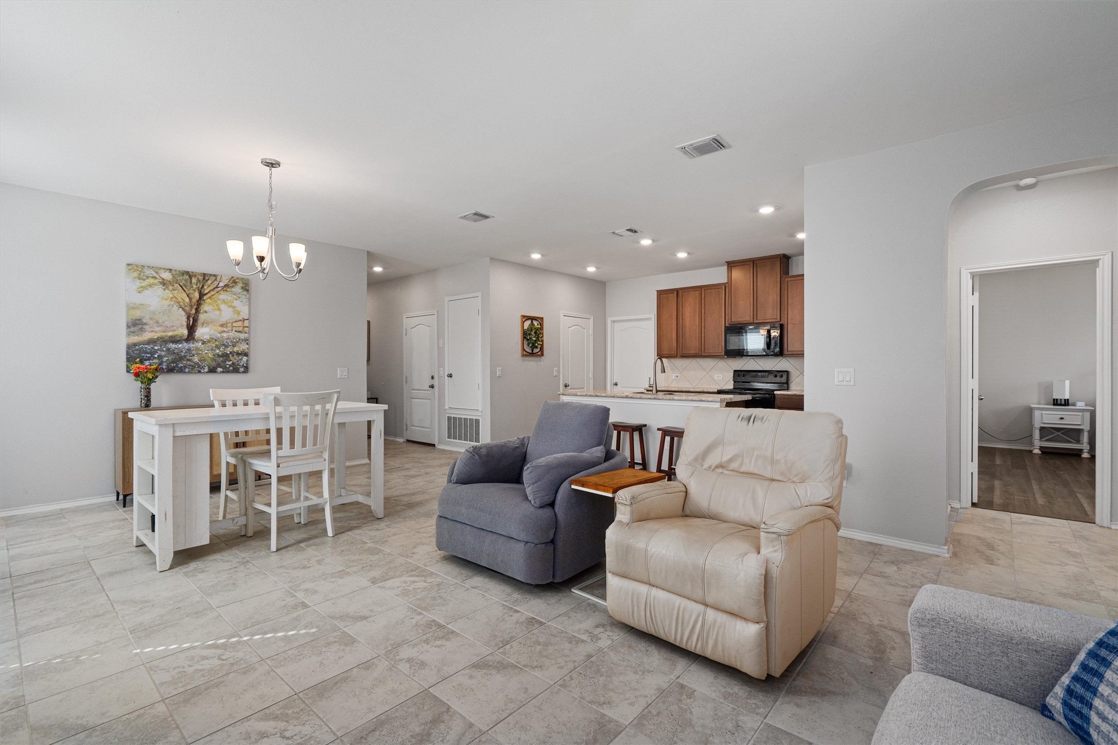 1906 Dragonfly Loop Bastrop, TX 78602 - Photo 9 of 34 a living room with furniture and kitchen view