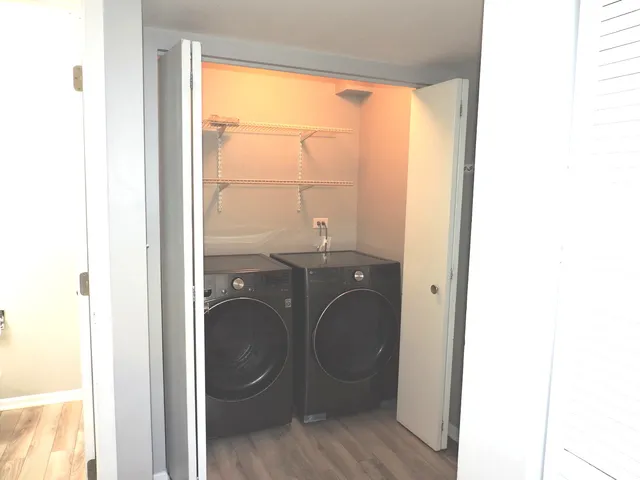a view of a bathroom with a sink and a window
