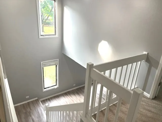 a view of a hallway view with staircase