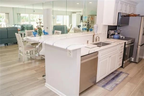$574,900 | 100 Bluff View Drive, Unit 105C, Belleair Bluffs, FL 33770