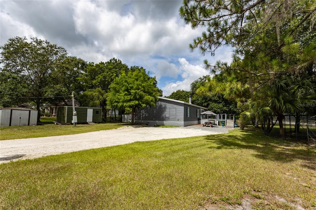 1013 Forest Park Street Bunnell, FL 32110 - Photo 19 of 24 a swimming pool with trees in the background
