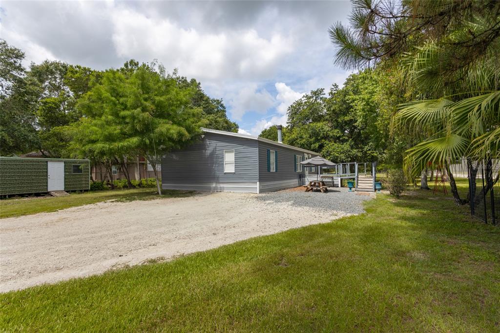 1013 Forest Park Street Bunnell, FL 32110 - Photo 2 of 24 a front view of house with yard and trees