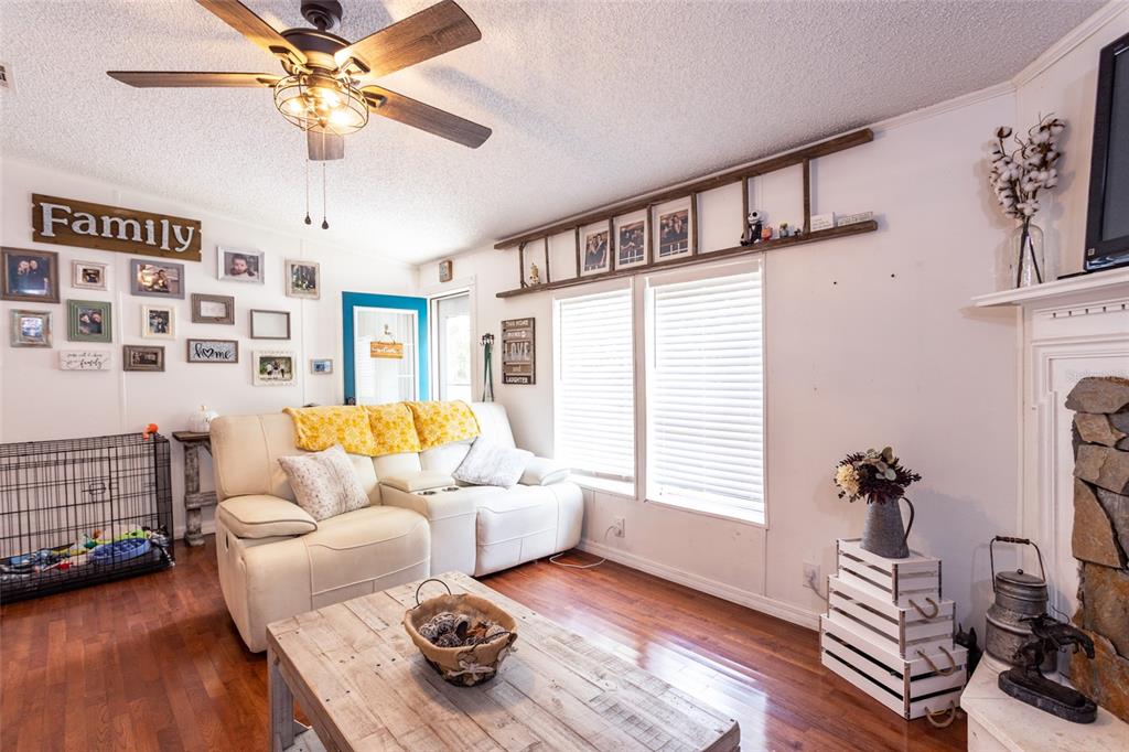 1013 Forest Park Street Bunnell, FL 32110 - Photo 5 of 24 a living room with furniture and wooden floor
