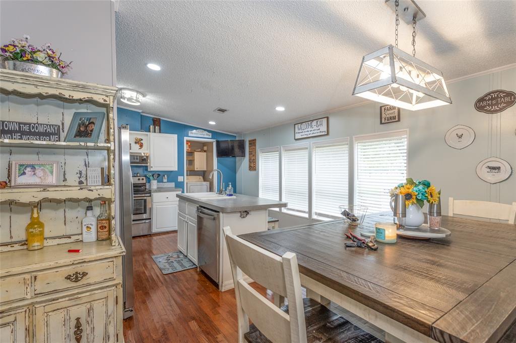 1013 Forest Park Street Bunnell, FL 32110 - Photo 7 of 24 a kitchen with a sink appliances and cabinets