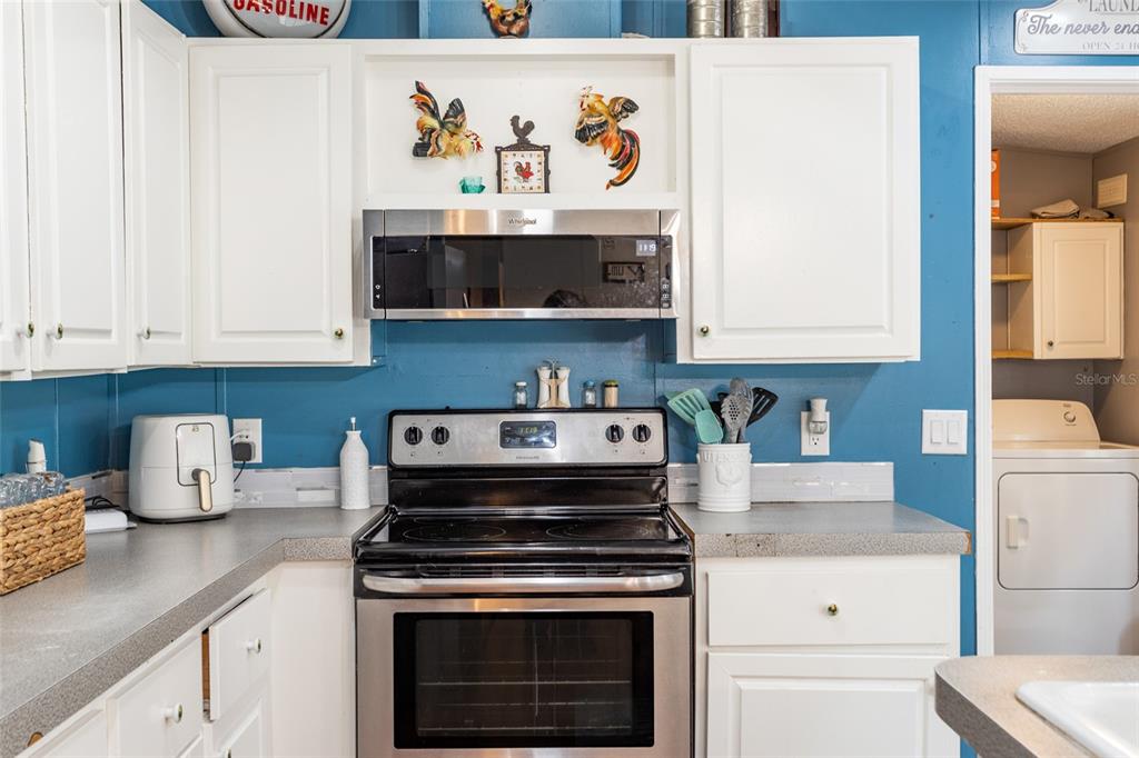 1013 Forest Park Street Bunnell, FL 32110 - Photo 10 of 24 a kitchen with a stove and cabinets