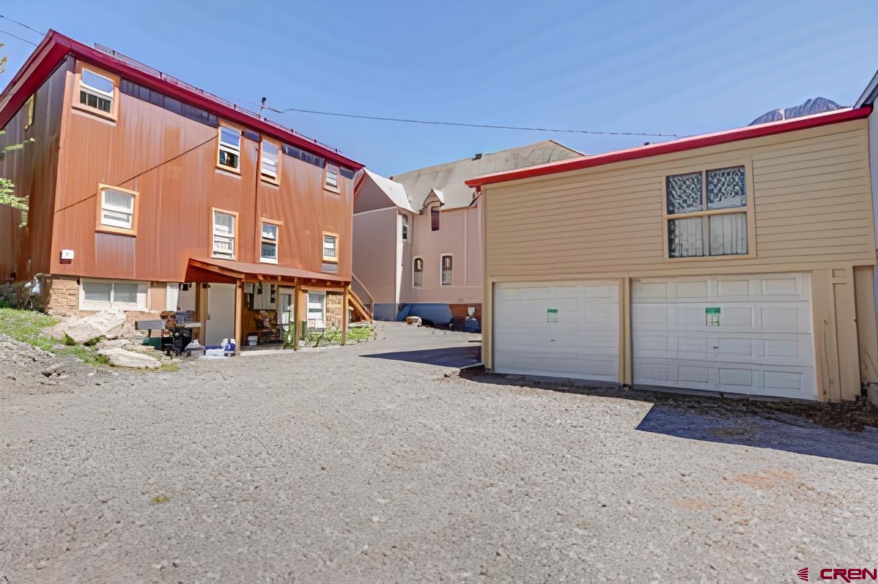 232 Main Street Ouray, CO 81427 - Photo 20 of 21 Back of building and 2 detached 2 car garage with storage above
