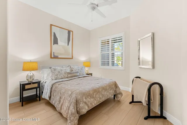 an aerial view of residential houses with outdoor space and ocean view