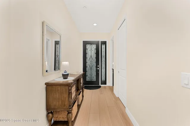 a kitchen with stainless steel appliances granite countertop a stove and white cabinets